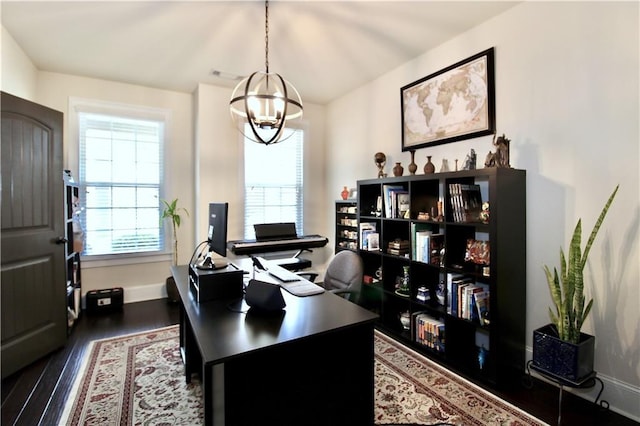 office featuring dark wood-type flooring and a notable chandelier