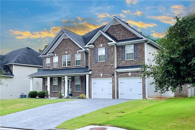 craftsman-style house featuring cooling unit, a porch, a garage, and a yard