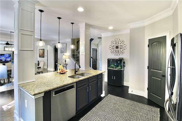 kitchen with sink, refrigerator, hanging light fixtures, dishwasher, and white cabinets