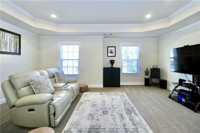 living room with crown molding, light carpet, and a tray ceiling