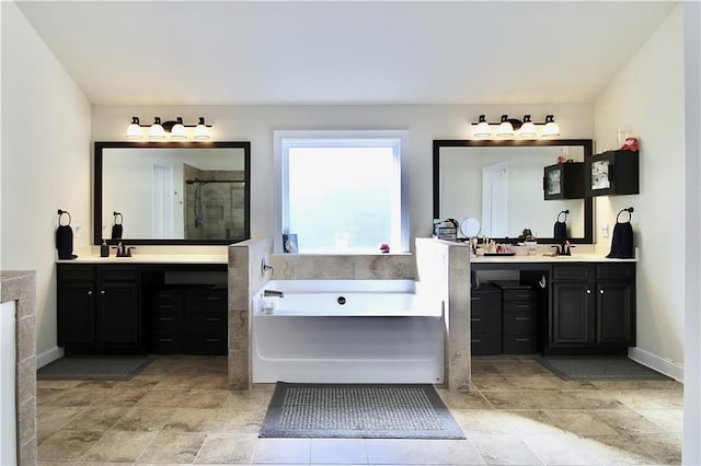 bathroom featuring vanity and shower with separate bathtub