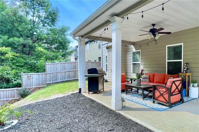 view of patio featuring an outdoor living space, ceiling fan, and grilling area