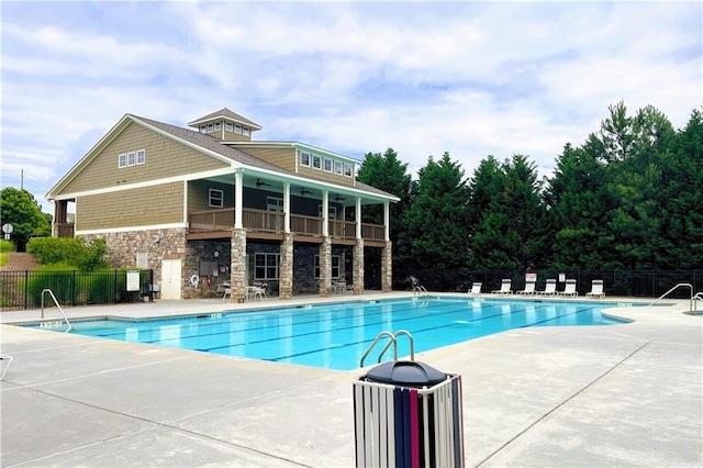 view of swimming pool with a patio area