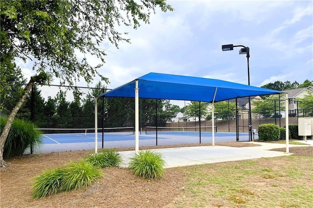 exterior space with tennis court