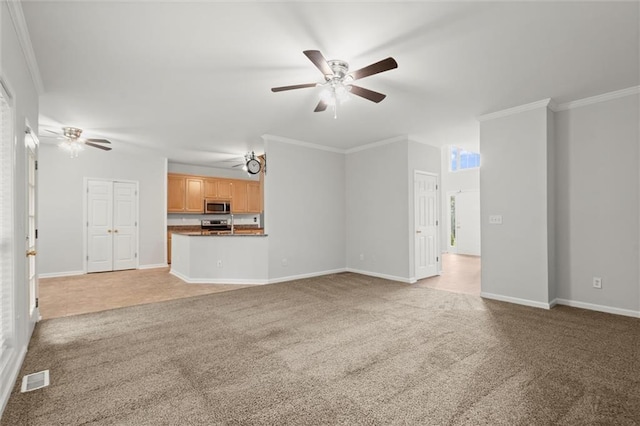 194 Lake Ruby Dr, Suwanee, GA 30024 - unfurnished living room featuring light colored carpet, a ceiling fan, baseboards, and crown molding