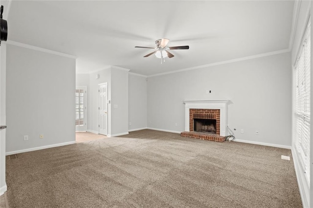 194 Lake Ruby Dr, Suwanee, GA 30024 - unfurnished living room featuring ceiling fan, crown molding, carpet, a brick fireplace, and baseboards
