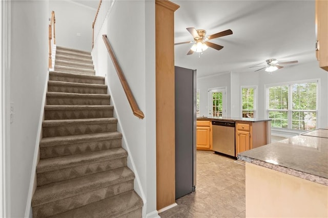 194 Lake Ruby Dr, Suwanee, GA 30024 - stairway featuring a ceiling fan, baseboards, and tile patterned floors