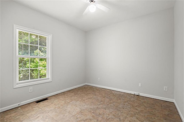 194 Lake Ruby Dr, Suwanee, GA 30024 - unfurnished room featuring healthy amount of natural light, a ceiling fan, and baseboards