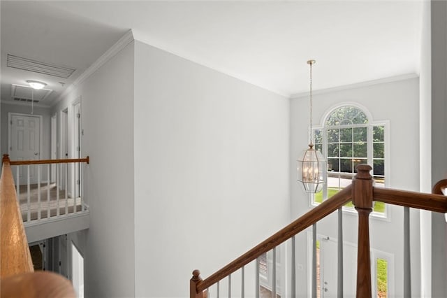 194 Lake Ruby Dr, Suwanee, GA 30024 - hall with an upstairs landing, ornamental molding, attic access, and a chandelier