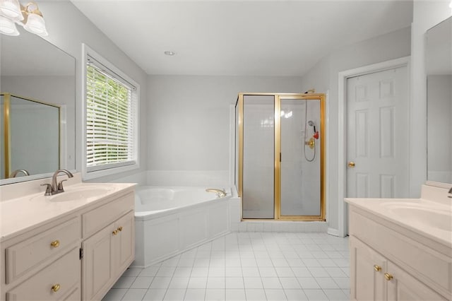 194 Lake Ruby Dr, Suwanee, GA 30024 - bathroom with two vanities, a shower stall, tile patterned flooring, and a garden tub