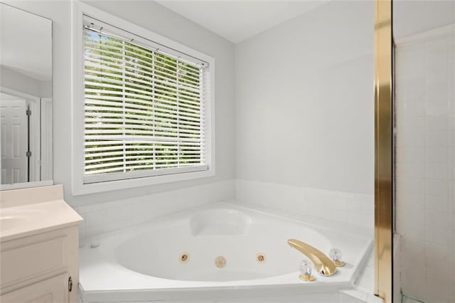 194 Lake Ruby Dr, Suwanee, GA 30024 - bathroom featuring vanity and a tub with jets