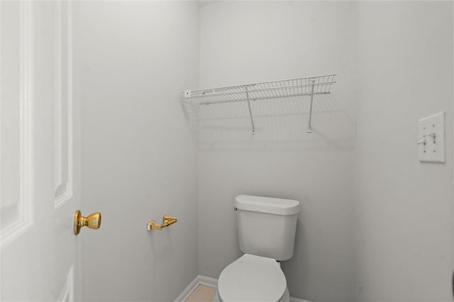 194 Lake Ruby Dr, Suwanee, GA 30024 - bathroom featuring toilet and baseboards