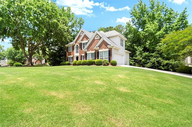 194 Lake Ruby Dr, Suwanee, GA 30024 - view of front facade featuring a front lawn, brick siding, an attached garage, and concrete driveway