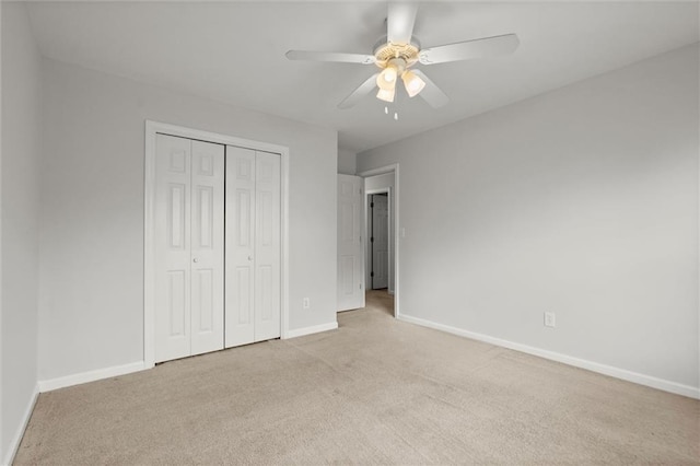 194 Lake Ruby Dr, Suwanee, GA 30024 - unfurnished bedroom with carpet flooring, baseboards, a closet, and ceiling fan