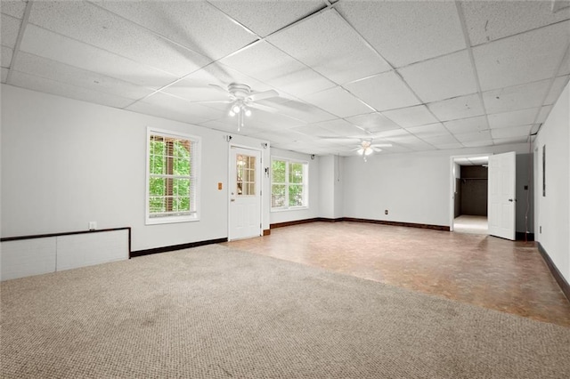 194 Lake Ruby Dr, Suwanee, GA 30024 - empty room featuring a ceiling fan, a drop ceiling, baseboards, and carpet flooring