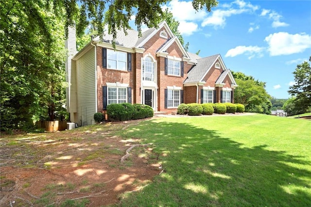 194 Lake Ruby Dr, Suwanee, GA 30024 - view of front of property with brick siding, a chimney, and a front yard