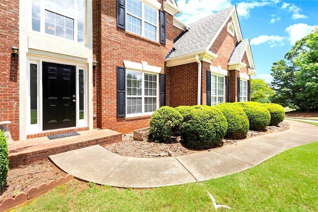 194 Lake Ruby Dr, Suwanee, GA 30024 - entrance to property featuring brick siding and roof with shingles