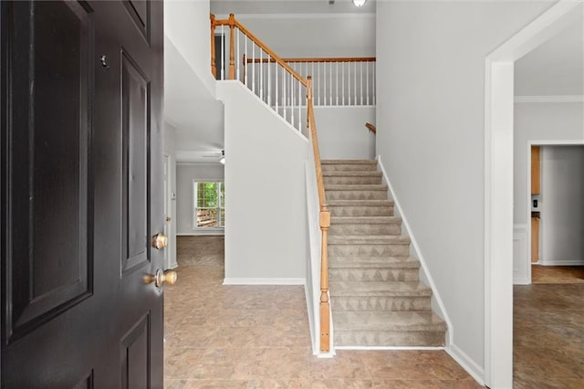 194 Lake Ruby Dr, Suwanee, GA 30024 - foyer with ornamental molding, stairway, and baseboards