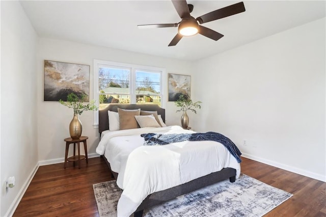 bedroom featuring ceiling fan and dark hardwood / wood-style floors