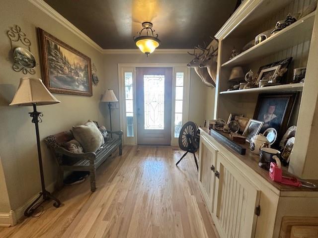 living area featuring ornamental molding, a ceiling fan, wood finished floors, a fireplace, and vaulted ceiling