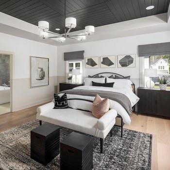 6450 Pond View Dr, Cumming, GA 30028 - bedroom featuring a raised ceiling, wooden ceiling, wood finished floors, a chandelier, and baseboards