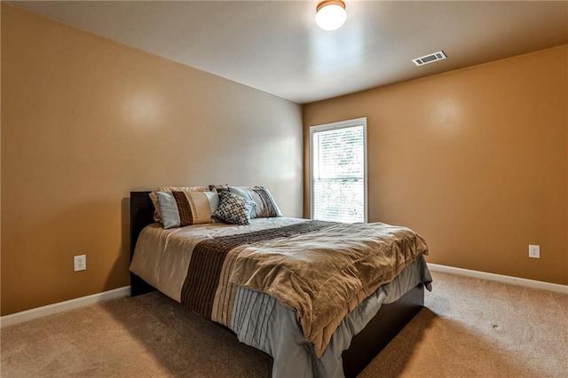 bedroom featuring light carpet