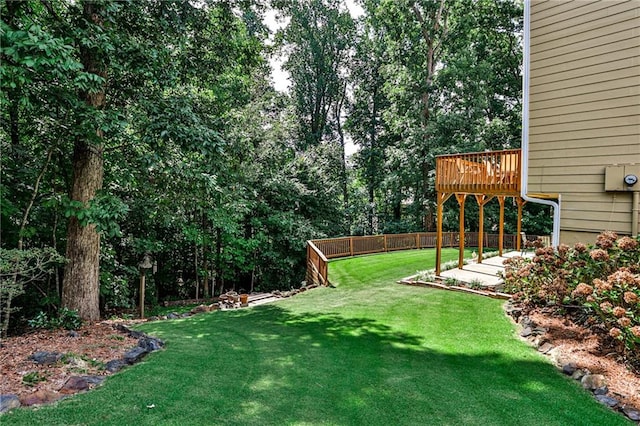 view of yard featuring a wooden deck