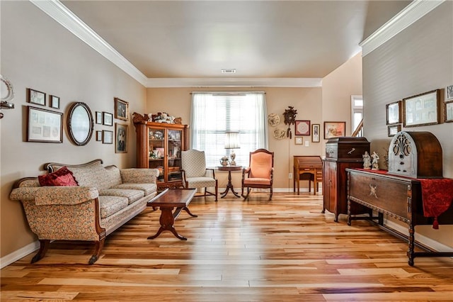 living room featuring light wood-type flooring and crown molding