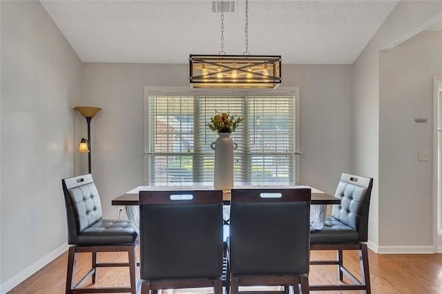 964 Natural Brook Trl, Lawrenceville, GA 30045 - dining area featuring wood finished floors and a textured ceiling
