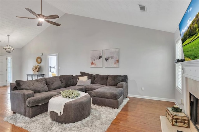 964 Natural Brook Trl, Lawrenceville, GA 30045 - living area featuring high vaulted ceiling, a fireplace, light wood-style floors, and plenty of natural light