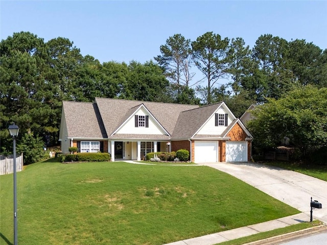 964 Natural Brook Trl, Lawrenceville, GA 30045 - view of front of property with concrete driveway, a front yard, covered porch, and brick siding