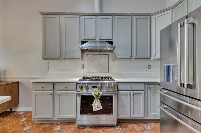 964 Natural Brook Trl, Lawrenceville, GA 30045 - kitchen featuring appliances with stainless steel finishes, exhaust hood, gray cabinetry, light countertops, and light tile patterned floors