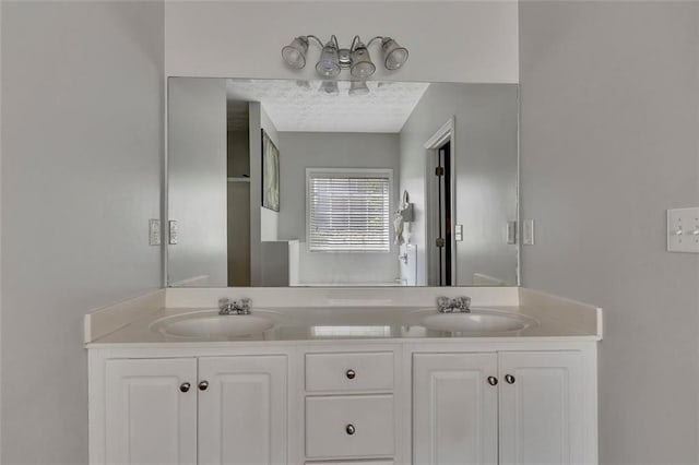 964 Natural Brook Trl, Lawrenceville, GA 30045 - bathroom with double vanity and a textured ceiling