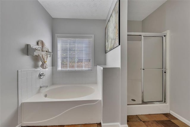 964 Natural Brook Trl, Lawrenceville, GA 30045 - bathroom with a shower stall, a bath, and a textured ceiling