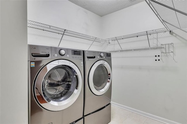 964 Natural Brook Trl, Lawrenceville, GA 30045 - washroom with washing machine and clothes dryer and tile patterned flooring