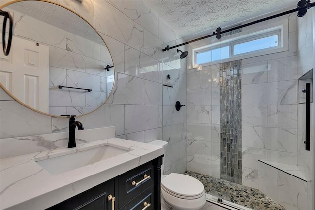 964 Natural Brook Trl, Lawrenceville, GA 30045 - bathroom with tile walls, vanity, a stall shower, and a textured ceiling