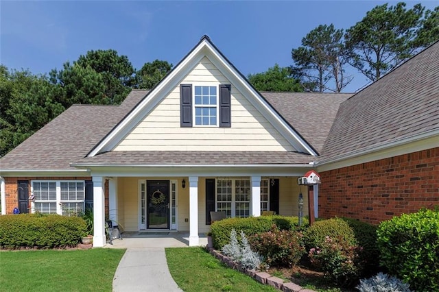 964 Natural Brook Trl, Lawrenceville, GA 30045 - view of front of house with roof with shingles, covered porch, and a front yard