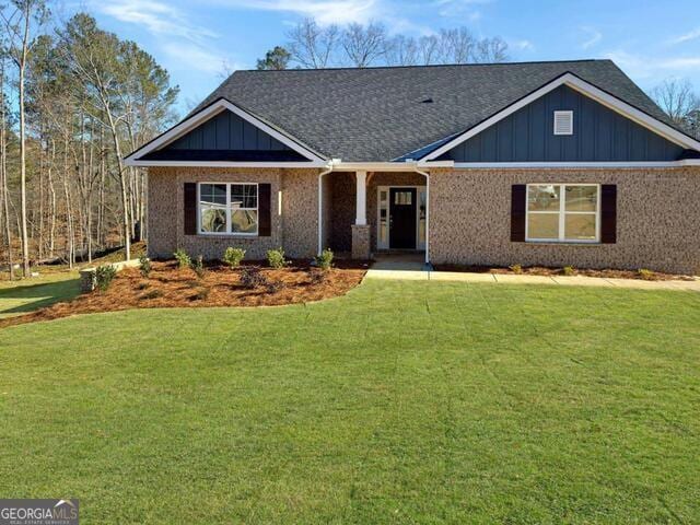3402 Milan Ct Lot 1Plapprox Sqft 2, Douglasville, GA 30135 - view of front of house featuring a front lawn, board and batten siding, and a shingled roof