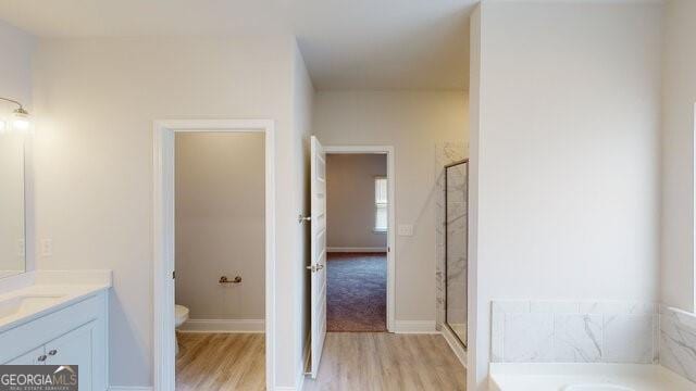 3402 Milan Ct Lot 1Plapprox Sqft 2, Douglasville, GA 30135 - bathroom featuring wood finished floors, a bath, vanity, and a shower stall