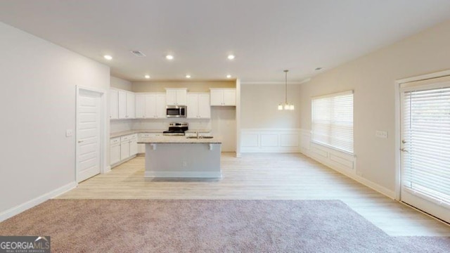 3402 Milan Ct Lot 1Plapprox Sqft 2, Douglasville, GA 30135 - kitchen with appliances with stainless steel finishes, white cabinetry, a center island with sink, open floor plan, and light countertops