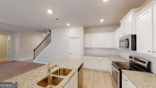3402 Milan Ct Lot 1Plapprox Sqft 2, Douglasville, GA 30135 - kitchen with stainless steel appliances, white cabinets, light stone counters, and recessed lighting