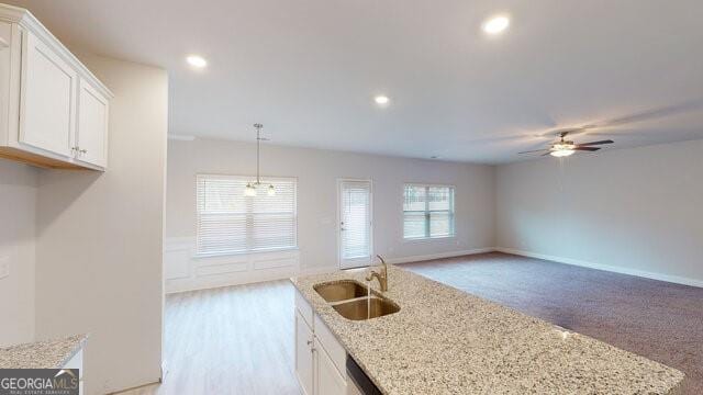3402 Milan Ct Lot 1Plapprox Sqft 2, Douglasville, GA 30135 - kitchen featuring ceiling fan, white cabinets, light stone counters, an island with sink, and recessed lighting