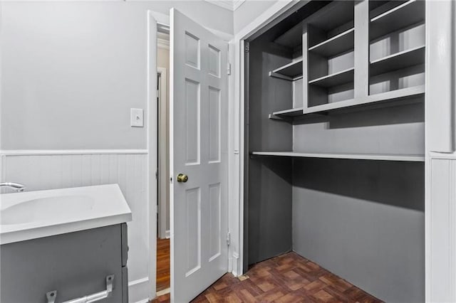 interior space featuring dark parquet floors and sink