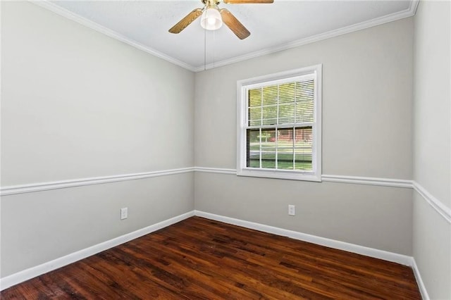 spare room featuring ceiling fan, dark hardwood / wood-style flooring, and ornamental molding