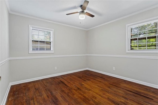 unfurnished room with crown molding, ceiling fan, plenty of natural light, and dark wood-type flooring