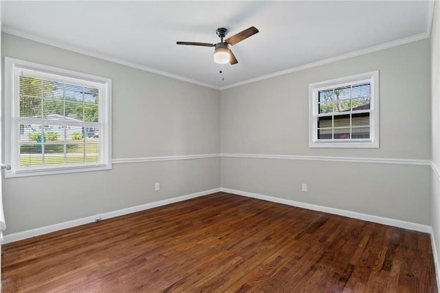 unfurnished room with ceiling fan, dark wood-type flooring, a healthy amount of sunlight, and ornamental molding