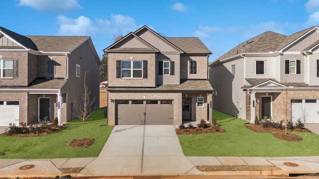 view of front of house with a garage and a front lawn