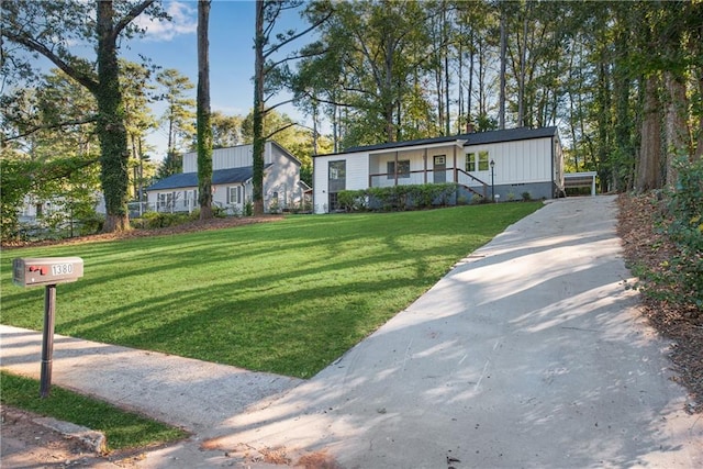 manufactured / mobile home with a porch and a front yard