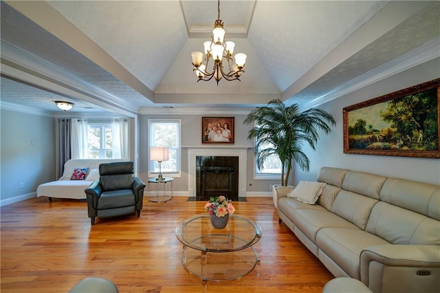 3265 Bethesda Park Ct, Lawrenceville, GA 30044 - living area featuring a chandelier, a high end fireplace, wood finished floors, baseboards, and ornamental molding
