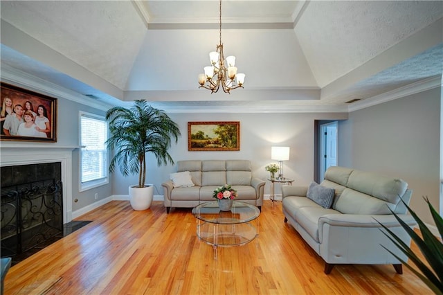 3265 Bethesda Park Ct, Lawrenceville, GA 30044 - living area with a chandelier, lofted ceiling, wood finished floors, baseboards, and a tiled fireplace